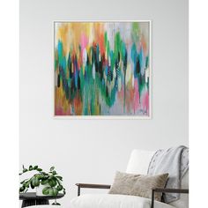 an abstract painting hangs on the wall above a white chair in a living room with a potted plant