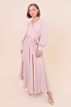 The Andie Dress in Powder Pink is finally here! T he twirl-worthy skirt and long sleeves make it a great choice for any and every special occasion. And did we mention, it's perfect for nursing mothers? This dress features a wrap front for easy access, a detachable waist tie, and functional wrist buttons for added convenience. She's a great choice for weddings, whether you're a bridesmaid, mother of the bride or a wedding guest! No matter the occasion, this is the dress for your next big event! Powder Pink Dress, Mariposa Dress, Cotton Candy Dress, Starry Night Dress, Icy Pink, Ivy City Co, Lover Dress, Lacey Dress, Mommy And Me Dresses