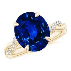 an oval blue sapphire and diamond ring in yellow gold