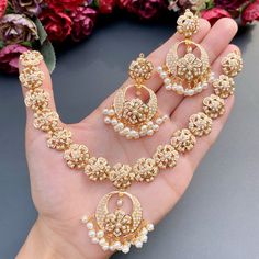 Featuring a harmonious floral pearl necklace with chandbali earrings in 22ct gold. The necklace set has been adorned with freshwater pearls. The weight of the necklace is 25.77 GMs including 1.58 GMs in hanging pearls. The earrings weigh 16.04 GMs including 3.14 in hanging pearls. Price Breakup Summary Component Rupees % of Total 22k Gold 188,778 76.4% Stones & Beads 17,134 6.9% Making Charges 33,980 13.8% Taxes (GST) 7,197 2.9% Total 247,089 100.0% View Detailed Price Breakup Latest Indian Jewellery, Rajputi Jewellery, Bridal Jewelry Sets Brides, Bridal Jewellery Inspiration, Bridal Necklace Designs, Antique Necklaces Design, Ring Bands, Fancy Jewelry Necklace, Bridal Jewelry Vintage