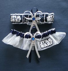 two star wars garters with ribbons attached to them