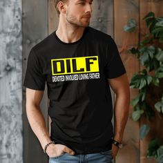 DILF Tee Devoted Involved Loving Father. Get some laughs from your fellow dad-friends with this humorous black graphic tee. Pair it with shorts or jeans any time of the year. Fabric Content: 100% Cotton Shirt Brand: Bella Canvas Sizing (unisex fit): XS: 0-2, S: 4-6, M: 8-10, L: 12-14, XL: 16-18, 2XL: 20-22, 3XL: 24-26 Actual Measurements: XS Chest: 35", Length: 23" S Chest: 40", Length: 25" M Chest: 44", Length: 27" L Chest: 48", Length: 28.5" XL Chest: 53", Length: 30.5" 2XL Chest: 55", Length: Fox Clothing, Loving Father, Kids Graphics, Black Graphic Tee, Kid Lifestyle, Black Graphic Tees, Gym Tops, Jogger Sweatpants, Jean Leggings