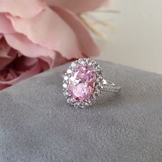 "Large Pink Topaz Sterling Silver cocktail Ring, Large Engagement Ring, Promise Ring, Evening Ring, mothers day gift, Gifts for Girlfriends, 💎 Gem Stone: Pink Topaz 💎 Gemstone Shape: Square 💎 Material: Sterling Silver with 18k white gold plating. 『 Other Precious metal bands are available in white gold, rose gold or yellow gold.』please contact us for custom orders. This exquisite designer ring is made with hand-selected 100% conflict free and environmental friendly natural topaz. The process Cubic Zirconia Crystal Ring With Halo Setting For Proposal, Pink Halo Ring With Accent Stones For Anniversary, Pink Halo Ring With Center Stone For Anniversary, Pink Oval Halo Ring For Anniversary, Cubic Zirconia Ring With Accent Stones For Proposal, Oval Cubic Zirconia Topaz Ring Birthstone, Oval Cubic Zirconia Topaz Birthstone Ring, Pink Sapphire Ring With Halo Design For Anniversary, Oval Flower Ring With Prong Setting For Anniversary