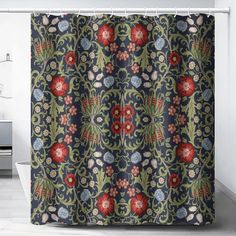 the shower curtain is decorated with red and blue flowers on dark blue background, along with white tile flooring