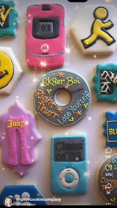 there are many decorated cookies in the shape of cell phones