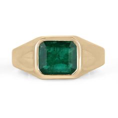 This men's solitaire ring features a striking 3.47-carat natural emerald cut emerald, set horizontally in a custom 14k gold bezel setting. The shank of the ring is adorned with etched triangles on the sides, adding a touch of subtle detail to the overall design. The emerald itself boasts a rich, dark green color and displays very good luster, making it a truly impressive centerpiece for this handsome ring. Setting Style: Bezel - Solitaire  Setting Material: 14K Yellow Gold Setting Weight: 9.5 Gr Modern Emerald Cut Emerald Signet Ring, Modern Emerald Signet Ring For Formal Occasions, Solitaire 14k Gold Jewelry, Super Bowl Rings, Emerald Set, Smaragd Ring, Emerald Gem, Tiny Bow, Solitaire Setting