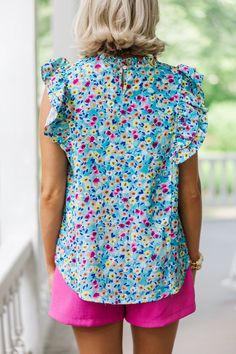 Be the talk of the town in our Better Believe It Aqua Blue Floral Blouse! Soft and lightweight, with charming ruffled sleeves, show off your style in this sweet, playful look. No one will be able to deny your chic, flowery 'fit. Trust us, it's an absolute must-have! Round neckline Button keyhole back Ruffled cap sleeves Ditsy floral print No stretch Payton is wearing the small. Blue Floral Print Ruffle Sleeve Blouse, Blue Ruffle Sleeve Blouse With Floral Print, Blue Floral Print Blouse With Ruffle Sleeves, Blue Cotton Tops With Ruffled Collar, Blue Cotton Blouse With Ruffled Collar, Blue Ruffle Sleeve Tops For Vacation, Blue Floral Print Tops With Ruffle Sleeves, Blue Floral Print Blouse With Flutter Sleeve, Blue Flutter Sleeve Tops With Floral Print