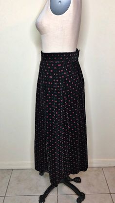 This is a black velvet skirt made by Hasting and Smith in Japan. It has an all over print of tiny flowers and geometric shapes. The skirt is pleated and has two deep pockets. Has a fun 50's vibe. It is 100 percent cotton and unlined. Two button and zip closure in back. So cute with a chunky sweater and boots. Size tag 8, no stretch, check measurements carefully. Measurements taken with skirt laying flat and doubled where appropriate. In order to determine fit we recommend comparing measurements Pleated Full Skirt, Retro Black Long Skirt, Retro Black Pleated Skirt, Vintage Black Skirted Bottoms, Black Vintage Pleated Skirt, Vintage Black Pleated Skirt, Vintage Black Lined Skirt, Black Vintage Tiered Skirt, Velvet Floral Midi Skirt