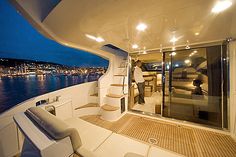 the interior of a boat with stairs leading up to it's upper deck area