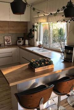 a kitchen with wooden counter tops and stools