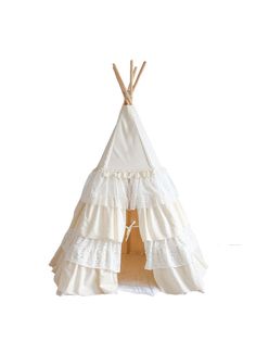 a teepee tent with white ruffled fabric and wooden sticks on the top, in front of a white background