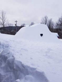 a pile of snow sitting next to a building