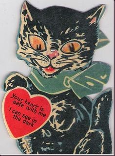 a black cat holding a red heart with the words your heart is safe with me i can see in the dark