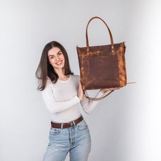 This handmade women tote bag is produced of distressed cowhide leather. It has one pocket inside. The bag has a high-quality zipper that secures your belongings. It holds the shape perfectly and you may be confident that your personal things like cell phone, tablet, lap-top are safe. This bag is simple, reliable, and durable. Its universal look allows to use the tote bag for various purposes. One may take the bag to the work, shopping, meeting, or walk and feel comfortable with it at any conditions. SIZE and DIMENSIONS:       〰️ SMALL 〰️ Height: 12 inches (30 cm) Width (the top): 12.6 inches (32 cm) Width (the bottom): 9 inches (23 cm) Depth: 4.3 inches (11 cm)      〰️ MEDIUM 〰️ Height: 13.4 inches (34 cm) Width (the top): 14.6 inches (37 cm) Width (the bottom): 11 inches (28 cm) Depth: 4. Distressed Brown Bags For Everyday Use, Distressed Brown Waxed Finish Shoulder Bag For Daily Use, Waxed Canvas Tote Shoulder Bag, Distressed Brown Shoulder Bag For Everyday Use, Distressed Brown Waxed Bags For Daily Use, Distressed Brown Waxed Finish Bag For Daily Use, Distressed Brown Oiled Leather Bag For Daily Use, Personal Things, Lap Top