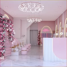 the interior of a pink and white salon with flowers on the wall, chandelier, stools and tables