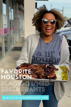 a woman holding a tray of food in front of a building with the words favorite houston black - owned restaurants