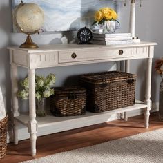 a white console table with baskets on it and a clock above it, in a living room