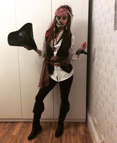 a woman dressed up as a pirate holding a megaphone