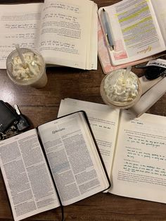 an open book sitting on top of a wooden table