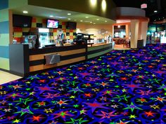 a brightly colored carpet in the middle of a restaurant