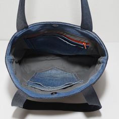 Everyday Denim Bags With Zipper Closure, Everyday Denim Shoulder Bag With Zipper, Denim Blue Bags With Zipper Pocket For On-the-go, Denim Bucket Shoulder Bag For Everyday, Everyday Denim Bucket Shoulder Bag, Denim Blue Cotton Shoulder Bag With Zipper Pocket, Everyday Use Denim Bucket Shoulder Bag, On-the-go Denim Shoulder Bag With Zipper Pocket, Everyday Denim Tote Canvas Bag