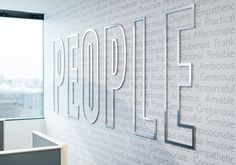 an office wall with the word people written on it