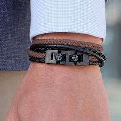 Whether you’re a casual or dapper kind of guy, a leather bracelet says you’ve got style! This double wrap, premium quality accessory in black and brown is a creative mix of retro and modern. The braided brown superfiber lends old world charm while the black high-endurance stainless steel double lock gives modern appeal. Clasp is lightweight and simple to open and close. Adjustable to accommodate varying wrist sizes. A bracelet from the Danish Lucleon to suit any guy, any colour scheme, any dress Roy Black, Red Bracelet, I'm With The Band, Stylish Bracelet, Mens Beaded Bracelets, Bracelet For Men, Mens Accessories Fashion, Basel, Sport Watches