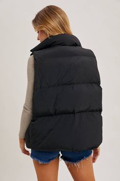 This Denim Layer Puffer Vest in black/denim offers a warm and stylish look. The fabric is soft and breathable, with a cozy lining made of 100% polyester. Enjoy a relaxed fit with a high collar and button-up front, secured by a zip closure. Look great and stay warm this winter! Black/Denim Casual Solid Puffer Jacket With Fleece Lining, Casual Solid Puffer Jacket With Padded Collar, Versatile Outerwear For Cold Weather In Winter, Black Cotton Puffer Jacket With Pockets, Black Cotton Puffer Outerwear, Black Cotton Puffer Jacket For Fall, Versatile Cotton Winter Outerwear, Versatile Cotton Outerwear For Winter, Black Warm Puffer Jacket For Fall