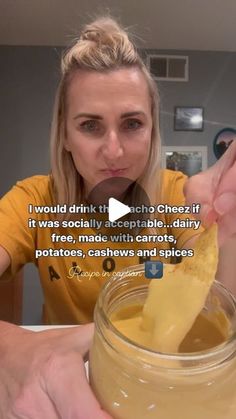 a woman is holding up a piece of food in front of her face with the caption i would drink it because she doesn