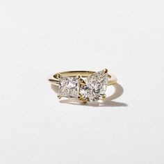 three stone diamond ring on white background