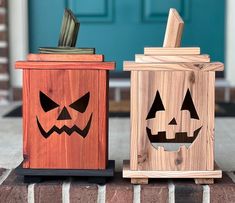 two wooden boxes with carved pumpkin faces on the front and side, one has a knife in it