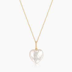 Our Gemma puffy heart in mother of pearl is an opulent shiny amulet to add a beachy flair to any look. Strung along our delicate Rae chain, it's a perfect addition for beach destinations or your everyday layers. 14k gold plated carved mother of pearl puffy heart charm on 1.2mm Rae cable chain. Adjustable between 18-20". PRODUCT NOTE : Carved stone may vary in texture, color, shape and size. These subtle differences make each piece unique. Charm measures approximately : 19mm x 17mm x 6mm Pearl Bangle Bracelet, Summer Layers, Beach Destinations, Puffy Heart Charms, Bracelets With Meaning, Pearl Bangle, Pearl Heart, Mother Of Pearl Necklace, Carved Stone