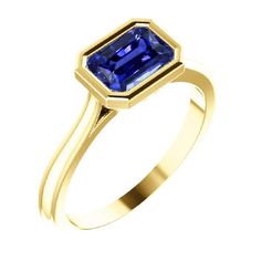 METAL SPECIFICATIONS Yellow Gold 14K STONE SPECIFICATIONS Stone Name : Blue Sapphire Stone Cut : Radiant Stone Details : There is one radiant cut sapphire approx. 1.50 carats (Approx. Size 7 x 6 mm). Natural earth mined stone. Quality of Sapphire : AAA Sapphire Treatment : Heated Total : Approx. 1.50 Carats RING SPECIFICATIONS Size : 6.5 (Can ship in any size, please send us a message about size after placing the order) Appraised Value : $3573.00 Comes with Certificate Blue Sapphire Stone, Emerald Blue, Solitaire Setting, Emerald Stone, Radiant Cut, Sapphire Stone, Natural Earth, Stone Cuts, Bezel Setting