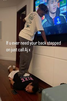 two people standing on their backs in front of a tv with the caption, if u ever need your back stepped on just call aj x