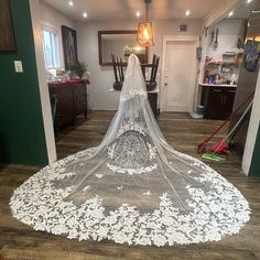 a wedding veil is laying on the floor