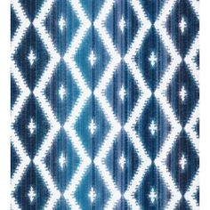 an abstract blue and white pattern on fabric