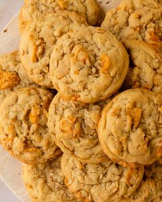 a pile of cookies sitting on top of a white plate