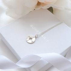 Silver Compass Necklace Be inspired by our dainty and meaningful compass necklace. Our silver compass necklace represents protection, love and a sense of home. This minimalist necklace comes with an inspirational description card and is packaged in a branded Bohemarie gift box, making this necklace the perfect gift for yourself or a special loved one. Necklace Details: * Compass Charm: 1.5 x 1.2cm * Chain Length: 40cm, 45cm or 50cm * Chain Style: Dainty Trace Chain * Material: 925 Sterling Silver * Skin Friendly: Hypoallergenic & Nickel-Free More From Us: * www.etsy.com/uk/shop/BohemarieJewellery Compass Design Pendant Necklace As Gift, Elegant Compass Design Necklaces As Gift, Elegant Necklace With Compass Design For Gift, Minimalist Compass Design Jewelry As Gift, Minimalist Compass Design Necklace As Gift, Silver Necklaces With Compass Design For Anniversary, Silver Compass Design Necklace For Anniversary, Dainty Jewelry With Compass Design For Gifts, Compass Design Round Jewelry For Gift