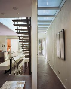 the interior of a modern house with stairs