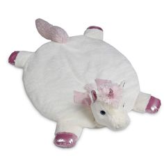 a white stuffed animal laying on top of a white floor cushion with pink ears and tail