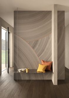 a room with wood flooring and a wall made out of wavy lines on the walls