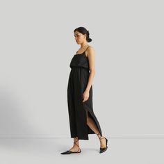 Elevate your style effortlessly with our chic Strappy Maxi Dress, perfect for those moments when you seek an elevated yet relaxed look. This dress features adjustable straps for a personalized fit and a sinched tie-front waist that accentuates your silhouette with a faux French tuck style. Embrace the ease and elegance of this relaxed-fit dress, complete with functional pockets on both sides and side slits for added comfort and movement. Ideal for warm weather occasions and versatile enough for various outings, this dress epitomizes the essence of relaxed sophistication. Explore the versatility of this wardrobe essential, ideal for casual gatherings, summer events, or as an elegant daytime ensemble. Front Twist Dress, Fitted Knee Length Dress, French Tuck, Strappy Maxi Dress, Twisted Dress, Maxi Sundress, Maxi Dress Black, Short Sleeve Maxi Dresses, Ballet Dress