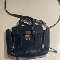 Blue Glossy Phillip Lim Purse Lightly Used Honestly In Great Shape Like Brand New Designer Blue Bag With Zipper Closure, Designer Blue Bags With Zipper Closure, Designer Blue Shoulder Bag With Zipper Closure, Chic Blue Satchel With Silver-tone Hardware, Designer Blue Bags For Work, Chic Blue Satchel With Zipper Closure, Phillip Lim Bag, Mini Purse, 3.1 Phillip Lim