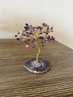 Crystal Gemstone Tree Decor with Natural Stones- Beautifully crafted crystal tree with natural stones and agate rock- It comes with little cute notes about crystal stone meaning.- It is in a beautiful gift box ready to give your loved ones!- Perfect decor for boho chic homes- Agate rock at the bottom of the treeAvailable in 7 colors:- Amethyst Crystal Tree (Purple)- Rose Quartz Crystal Tree (Pink)- Jade Crystal Tree (Green)- Citrine Crystal Tree (Yellow)- Carnelian Crystal Tree (Orange)- Sodalit Bohemian Gemstone Crystals For Gifts, Unique Natural Stones Crystals For Gifts, Unique Natural Stones Crystals As Gifts, Handmade Elegant Crystals For Gifts, Elegant Handmade Crystals For Gift, Unique Handmade Crystals For Gifts, Handmade Unique Crystals For Gifts, Purple Mineral Crystal As A Gift, Bohemian Mineral Crystal Gift