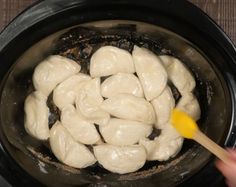 dumplings are being cooked in an electric pressure cooker