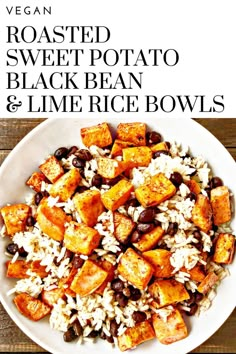 a white bowl filled with rice, beans and sweet potato salad on top of a wooden table