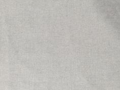 an image of a plain light grey fabric textured with some sort of stitching