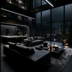 a living room filled with black furniture and large windows at night, overlooking the city