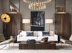 a living room filled with furniture and a chandelier