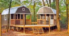 two tiny houses in the woods surrounded by trees